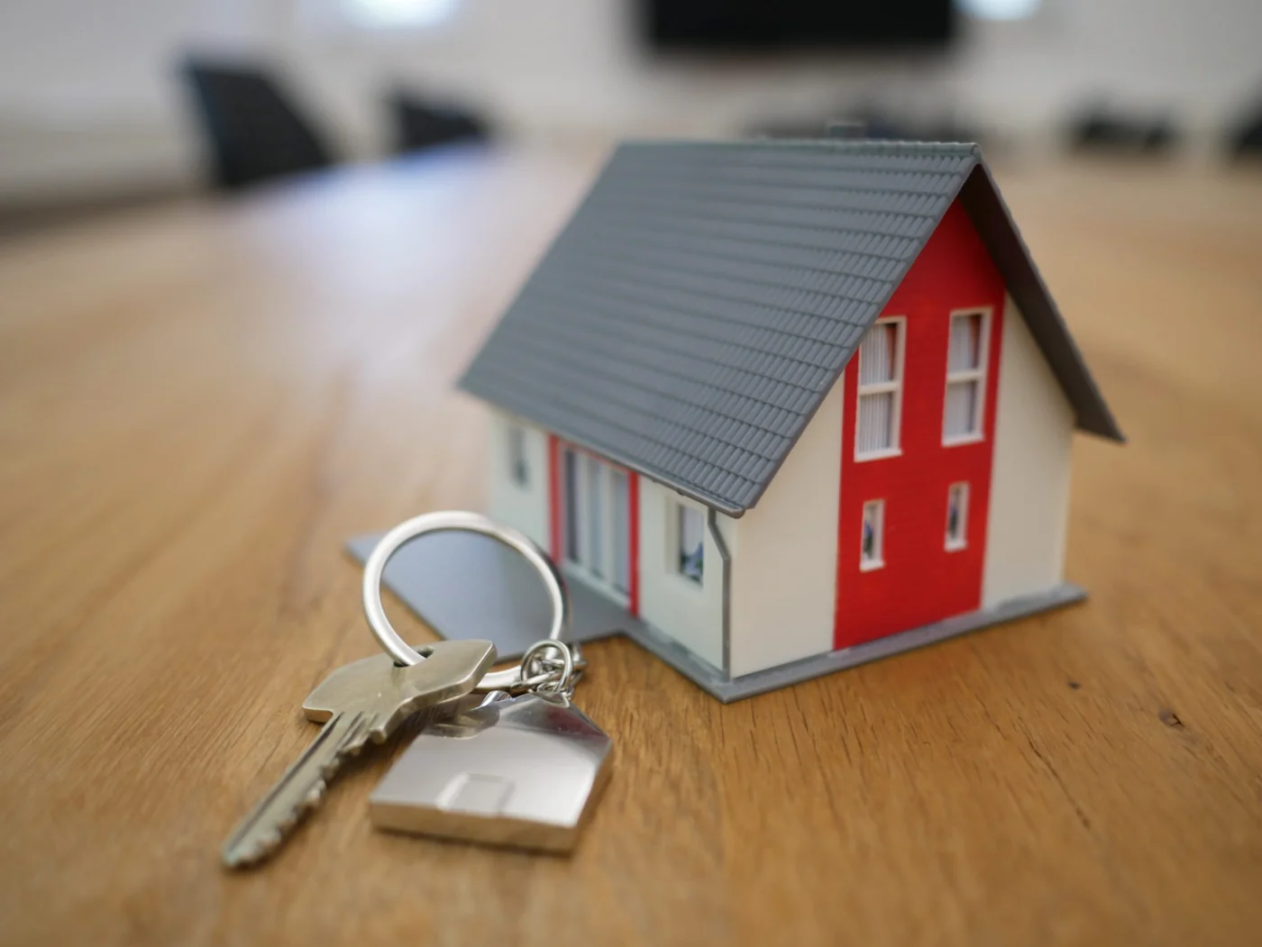 House keys and a model home on a table